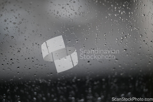 Image of Water drops on fogged glass with a gray brightness gradient