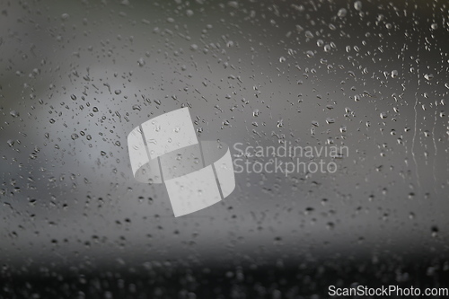 Image of Water drops on fogged glass with a gray brightness gradient