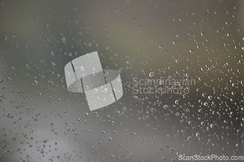 Image of Water drops on fogged glass with a gray brightness gradient