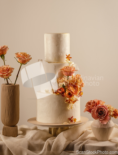 Image of Wedding cake decorated by flowers