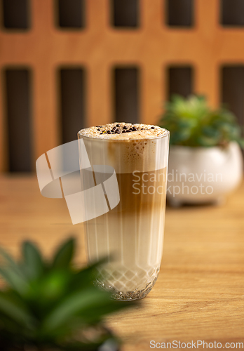 Image of Glass with delicious hot latte macchiato