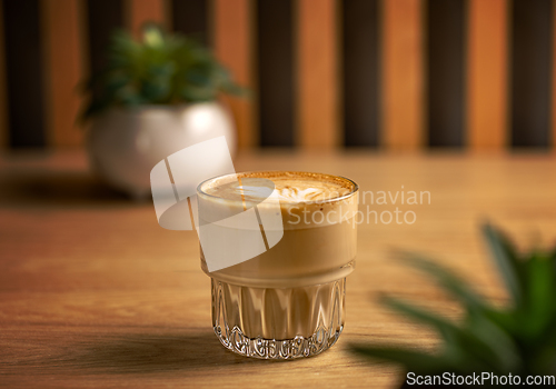 Image of Hot creamy milk in coffee.