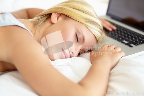 Image of Sleeping, computer and woman on bed tired from remote working, research and browse internet in bedroom. Burnout, stress and person with fatigue, exhausted and asleep with laptop for working from home