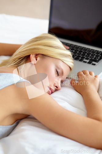 Image of Sleeping, laptop and woman on bed tired from remote work, research and online learning in bedroom. Education, stress and person with fatigue, exhausted and asleep on computer for student or studying