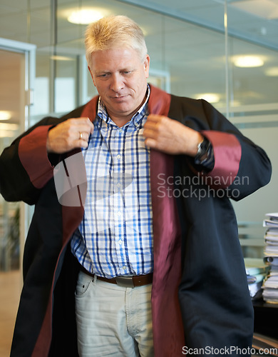 Image of University, professor and senior man in office with coat for graduation ceremony, teaching and education. College, professional school and mature teacher for academic career, learning and knowledge