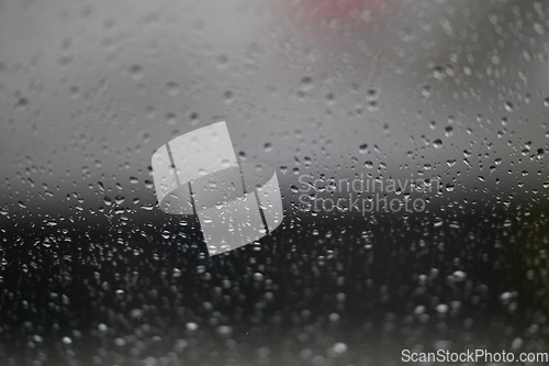 Image of Water drops on fogged glass with a gray brightness gradient