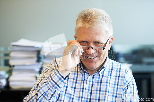 Image of Smile, glasses and senior man in the office with positive, good and confident attitude. Professional, happy and portrait of elderly male financial consultant with spectacles in modern workplace.