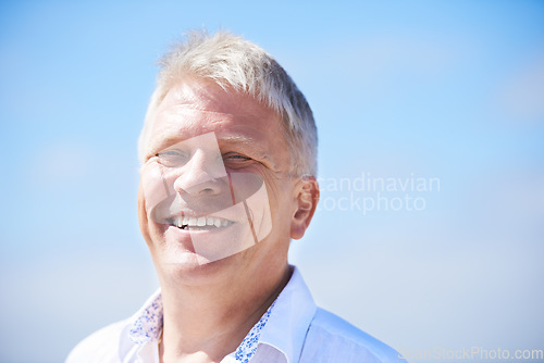 Image of Portrait, smile and happy senior man outdoor for travel, freedom or journey on blue sky background. Face, relax and old male person outside with positive attitude, fresh air or retirement vacation