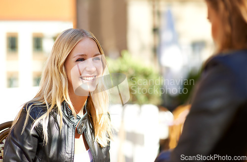 Image of Smile, face and woman friends talking outdoor at a coffee shop in summer together for bonding or reunion. Happy, chatting or conversation with young people at a cafe for a social gathering or catchup