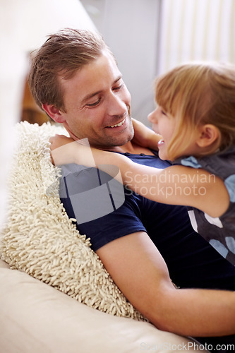 Image of Love, father or daughter and hug or happiness on bed in bedroom of home for bonding, care or weekend. Family, man and girl child with embrace in house or apartment with smile and joy for relationship