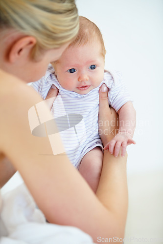 Image of Care, family and mother with baby, love and cheerful with trust, playful and happiness with newborn. Mama holding child, kid and mom with nursery in a home, relax and bonding together with wellness