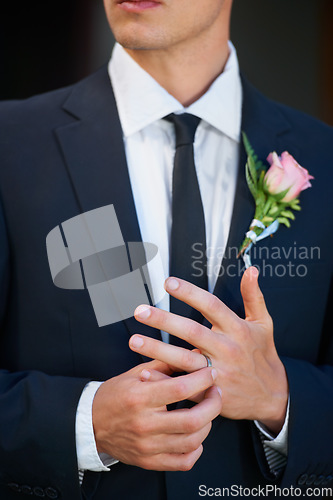 Image of Man, groom and hands with wedding ring for marriage, commitment or symbol of love, trust or care. Closeup of married male person in suit with flower and jewelry for vow, promise or engagement event