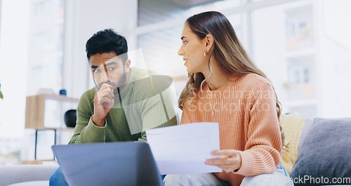 Image of Couple, finance and stress in home for debt, poor savings and budget of mortgage loan, taxes or bills. Anxiety of man, woman and paperwork at laptop for bankruptcy, financial risk or inflation crisis