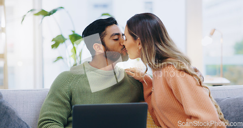 Image of Couple, love and kiss with laptop on sofa for movies, digital subscription and download multimedia show at home. Happy man, woman and relax at computer for affection, online shopping and connection