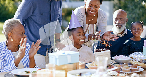 Image of Black family, birthday party and clapping for a boy child outdoor in the yard for a celebration event. Kids, applause and milestone with a group of people in the garden or backyard together in summer