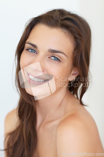 Image of Portrait, beauty and aesthetic with a young woman in studio on a white background for natural skincare. Face, smile or cosmetics and a happy person looking confident with her antiaging skin routine