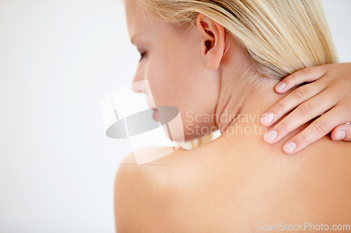 Image of Girl, skincare and touch back in studio with neck, eyes closed and dermatology by white background. Woman, model and beauty with peace, cosmetic change and transformation with glow for wellness