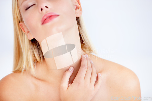 Image of Woman, skincare and touch neck in studio with wellness, eyes closed or beauty by white background. Girl, model and thinking with peace, cosmetic change and transformation with glow, results or vision