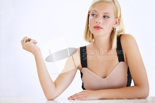 Image of Woman, attitude and fashion or hands, studio and elegant clothing or accessories, jewelry and confident. Female person, face and sassy or tough, assertive and beautiful or proud by white background