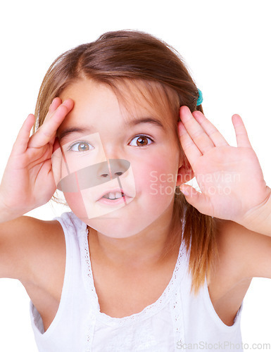 Image of Portrait, surprise and peekaboo with a girl child in studio isolated on a white background for a playful game. Face, hands or wow and a cute young kid having fun with a gesture for comedy or humor