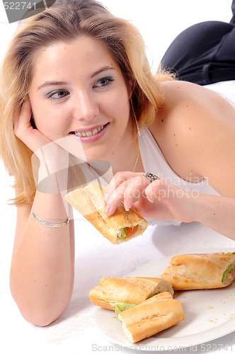 Image of Young pretty eating girl