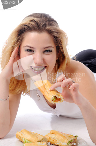Image of Young pretty eating girl