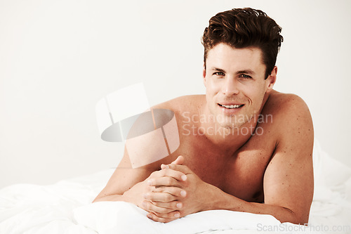 Image of Shirtless, man and happy portrait in bed to relax and wake up in morning, home or mockup. Cool, smile and face of person in bedroom on vacation, weekend or holiday with blanket, duvet and sheet