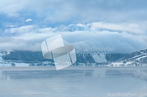 Image of Serene Winter s Sea Scene With Snow-Capped Mountain and Reflecti