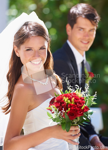 Image of Happy couple, portrait and wedding with bouquet of roses for love, care or just married at outdoor ceremony. Face of bride and groom smile for marriage, engagement or commitment together with flowers
