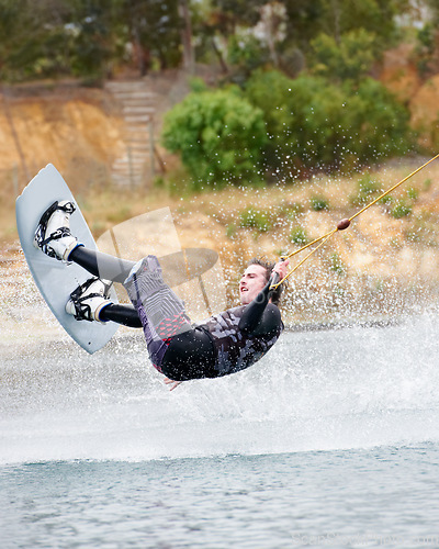 Image of Jump, wakeboarding and adventure, man on lake with outdoor fun, fitness and wave splash. Balance, water sports and person on river with freedom, speed and energy for surfing challenge, ski and trick