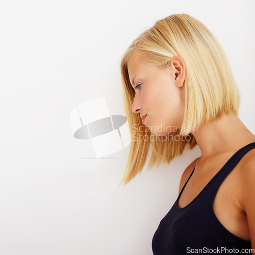 Image of Stress, thinking and profile of woman, sad and tired in studio isolated on a white background mockup space. Serious, frustrated person and girl with trauma anxiety, mental health crisis or depression