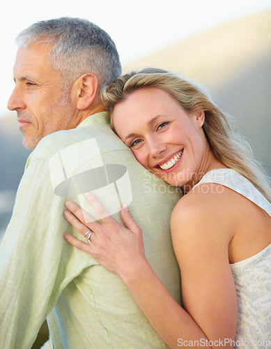 Image of Happy woman, portrait and hug man in marriage, love or embrace for honeymoon, romance or care together. Mature couple or female person hugging groom with smile outdoor in support, trust or commitment