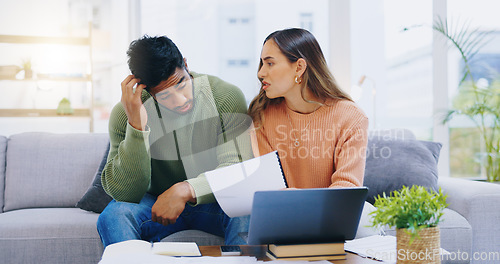 Image of Couple, debt and stress at laptop in home for poor savings, bills and budget of mortgage crisis, taxes or rent. Frustrated man, woman and banking documents for bankruptcy, financial risk or inflation