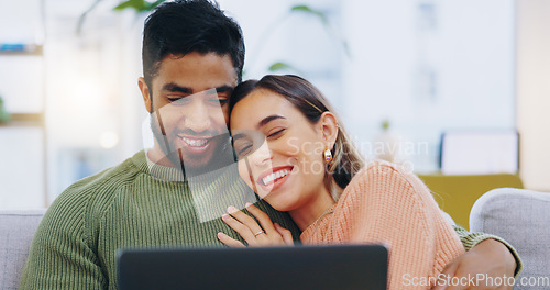 Image of Couple, laptop and relax on sofa in home living room with smile, hug and watch movie together on web. Man, woman and happy with computer for streaming subscription, show or film with embrace on couch