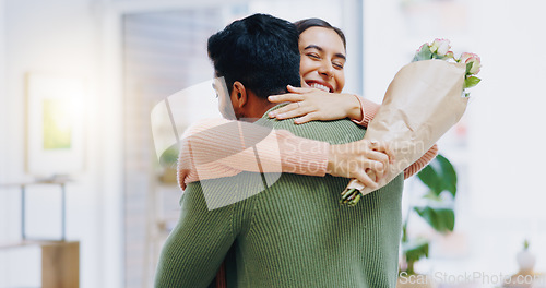 Image of Man, woman and hug with bouquet of flowers for smile, care or love on birthday, anniversary or celebration. Couple, roses and happy for present, gift or surprise for bonding, romance or home together