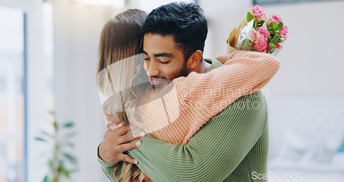 Image of Man, woman and hug with bouquet in home with roses for smile, care or love on birthday, anniversary and event. Couple, flowers and happy for present, gift or surprise for bonding, romance or together