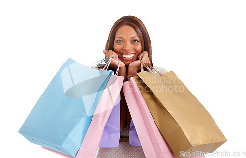 Image of African woman, shopping bag and excited in portrait with smile for deal, discount or retail by white background. Girl, luxury customer experience and happy with gift, present and sales from boutique