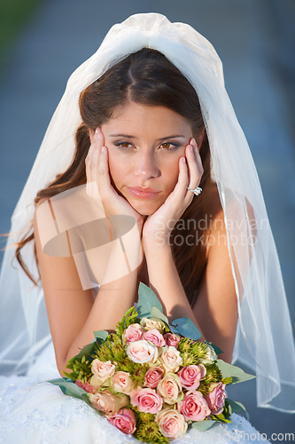 Image of Wedding, woman and bride with bouquet for thinking, unhappy and disappointed with ceremony, commitment or event. Marriage, person and face with feeling down, sadness and gloomy outdoor in nature