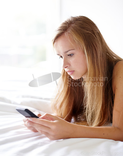 Image of Woman, bed and phone for texting, reading and thinking with search, communication or web blog in home. Girl, smartphone and click for social network, application or relax in morning, bedroom or house