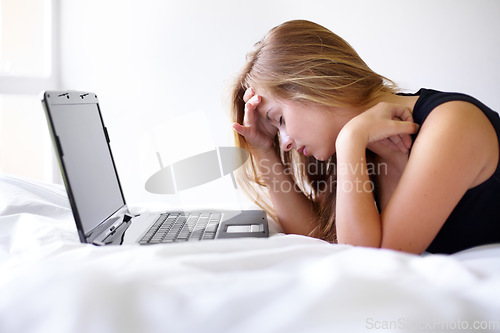 Image of Student woman, laptop and stress on bed with mistake for exam, assessment or test with online course. Girl, studying and education with computer in bedroom for elearning, 404 glitch and error in home
