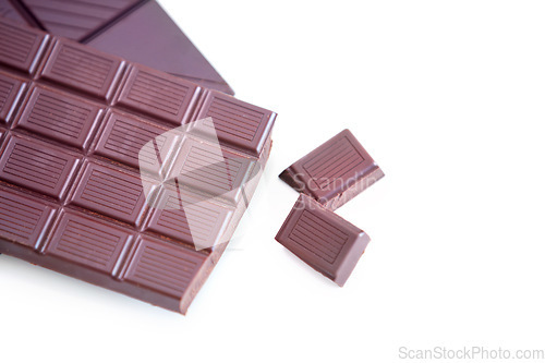 Image of Milk chocolate, studio candy and cacao sweets for delicious swiss bar, wellness and dark cocoa grid slab, tasty dessert or snack. Junk food, sugar treat and luxury premium product on white background