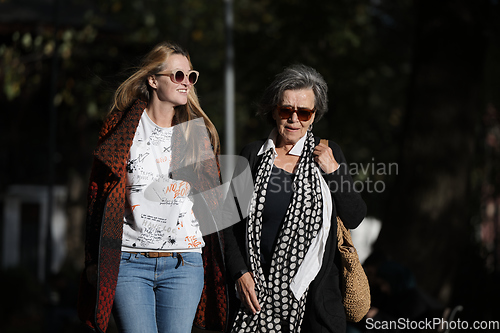 Image of Elderly old cute woman with Alzheimer's very happy and smiling when eldest daughter hugs and takes care of her