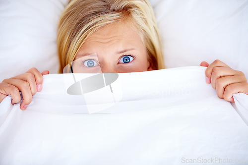 Image of Portrait, bedroom and blanket with woman, fear and scared with anxiety, expression and emotion. Face, person and girl with a sheet, home and depression with stress, mental health and insomnia