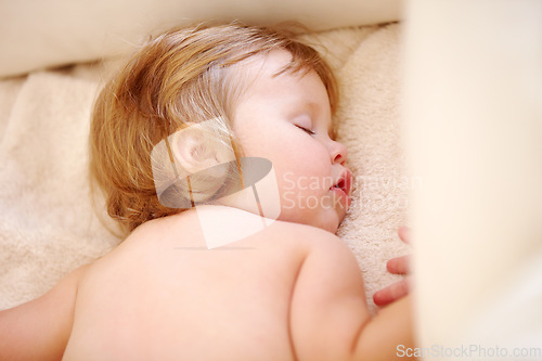 Image of Closeup, baby and face for sleep on bed from good dream, nap or rest in nursery. Toddler, relaxing or peaceful on pillow, blanket or cozy for child growth, tired or development for future in home