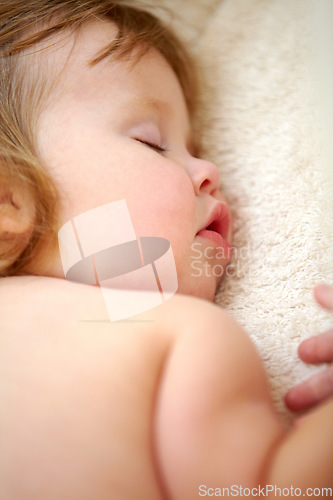 Image of Closeup, baby and face for sleeping in nursery on bed for good dream, nap or rest. Toddler, little girl and relaxing on pillow for child growth with love, care and support for , cognitive development
