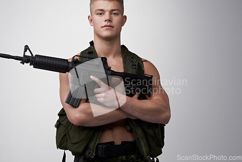 Image of Soldier man, vest and rifle in studio portrait for military service, fight and fitness by white background. Army agent, government employee and bodybuilder in tactical clothes for battle, war and gun