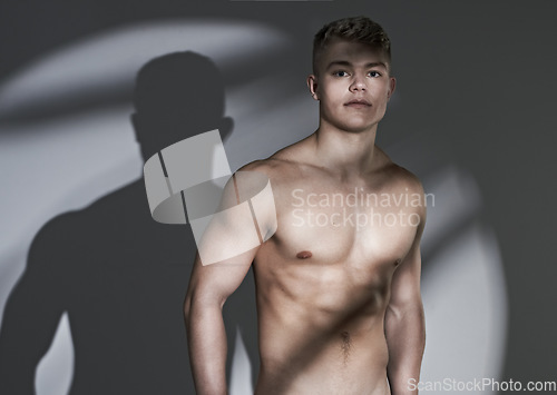 Image of Man, bodybuilder and muscle in studio portrait, shirtless or confident for wellness by white background. Person, topless model and exercise for healthy body for pride, strong and skin for aesthetic