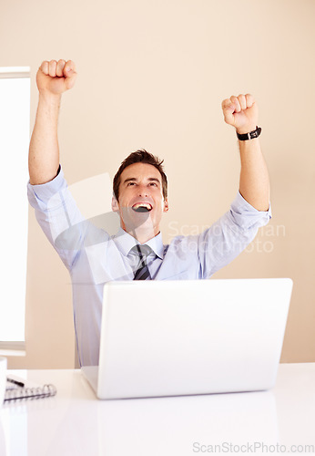 Image of Business man, celebration and laptop with fist, shout and happy for profit, revenue or success on stock market. Investor, trader and computer for financial freedom, goals and cheers with bonus on web