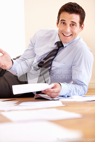 Image of Business man, documents and portrait on floor with smile for audit, tax and compliance with financial review. Accountant, entrepreneur and happy with paperwork in workplace, stats and administration