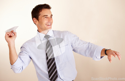 Image of Business man, throw paper plane and happy for thinking, vision or game with transport symbol by white background. Entrepreneur, airplane and smile with ideas, icon and playful at accounting agency
